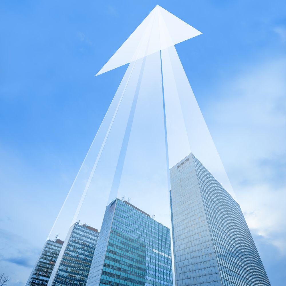 Buildings with overlayed arrow displaying growth